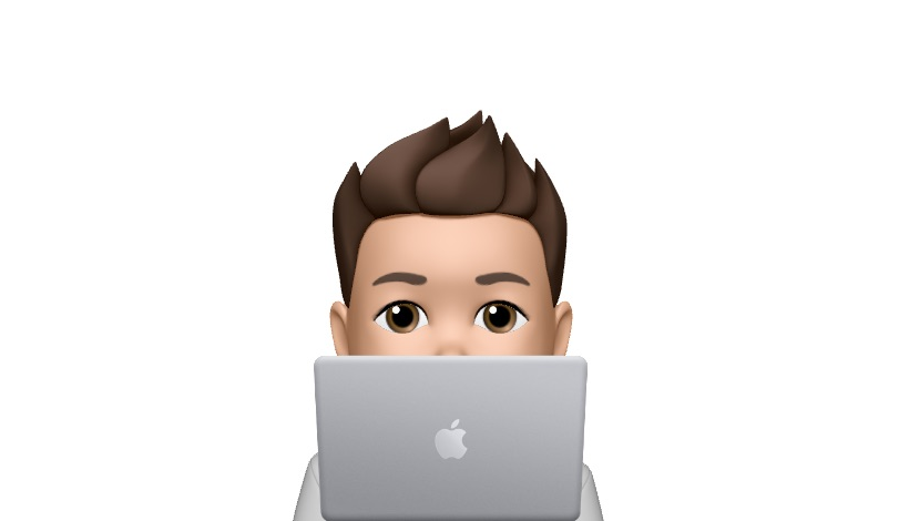 Apple Memoji of Jamie in front of a macbook